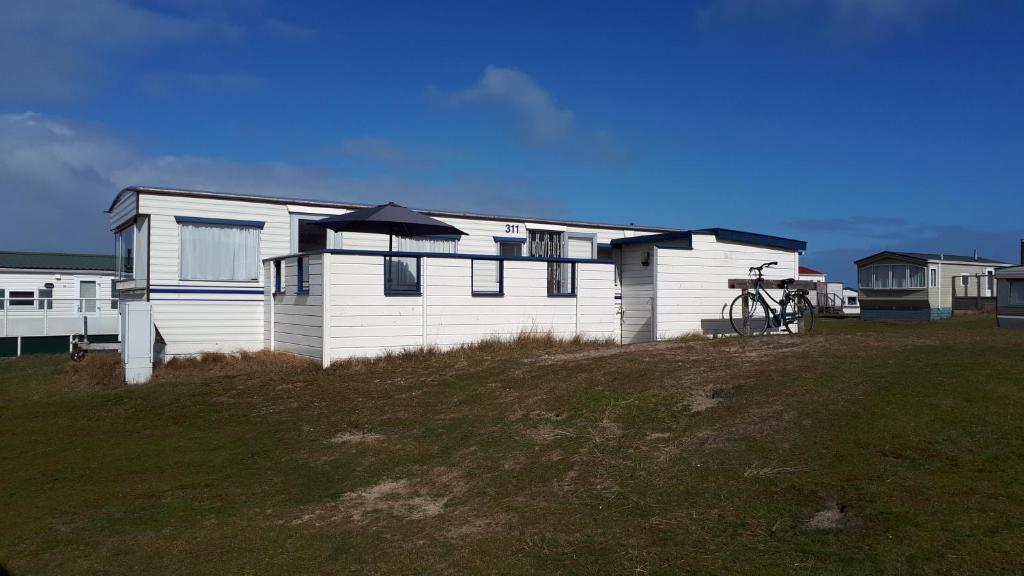 AMELAND - Ballum: Stacaravan Chalet (incl. fietsen) bij strand en zee